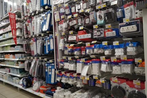 Selection of extension 3 pin plug socket wire on supermarket. Many adapter po Stock Photos