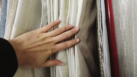 Selection of fabric-hands that touch the fabric - stock Stock Footage 106757252