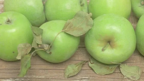 A Selection of Fresh, Crisp Green Apples Arranged Beautifully on a Wooden Table Stockbeeldmateriaal 283826953