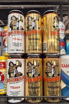 Selection of German beer cans featuring traditional designs on display 스톡 사진