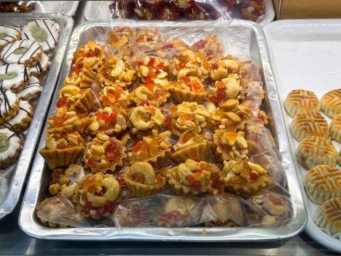 Selection of handmade Middle Eastern pastries and sweets displayed in trays at a Stock Photos