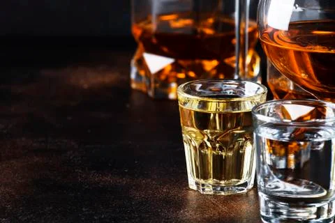 Selection of hard alcoholic drinks in big glasses and small shot glass in ass Foto stock