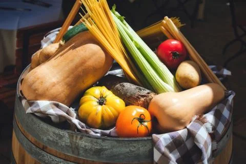 A selection of healthy winter vegetables on display on top of a barrel Stock Photos