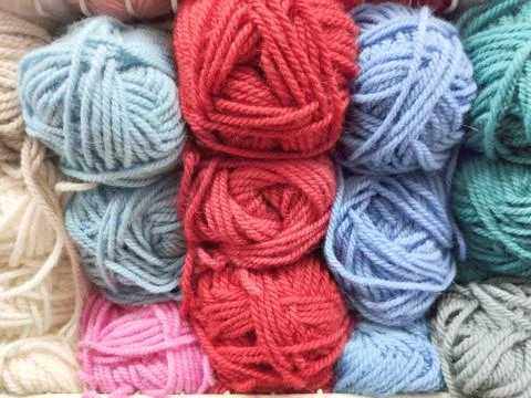 Selection of multi-colored skeins on the shop window Stock Photos