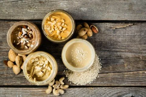 Selection of nut butters - peanut, cashew, almond and sesame seeds Stock Photos