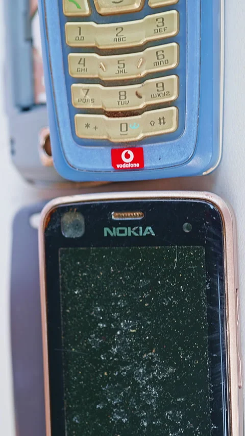 A selection of old NOKIA cell phones that are defective, obsolete, non-functi Stock-Footage 287483056