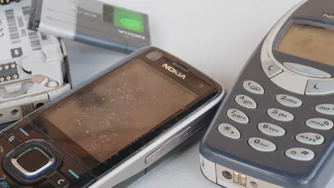 A selection of old NOKIA cell phones that are defective, obsolete, non-functi Vídeo Stock 287483456
