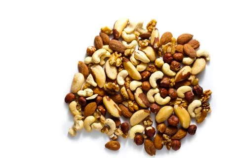 A Selection of Organic Nuts on White Surface Stock Photos