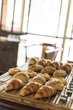 Selection of pastries and bread on display in french cafe buffet Stock Photos