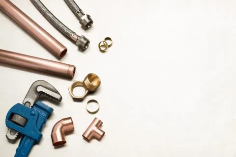 Selection of Plumbers Tools and Plumbing Materials with Copy Space Stock Photos