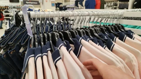 Selection of polo shirts by size Stock Footage 220606190