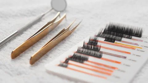 A selection of professional eyelash extension tools and synthetic lashes are Video stock 276667072
