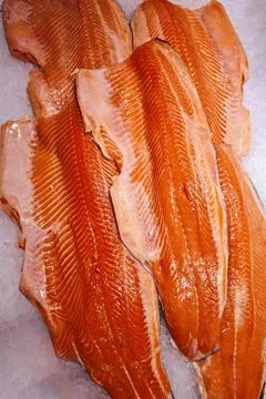 Selection of salmon fillets, showcasing their vibrant orange hue and intricat Fotos de archivo