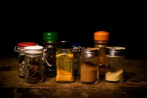 Selection of spices in rustic setting 库存照片