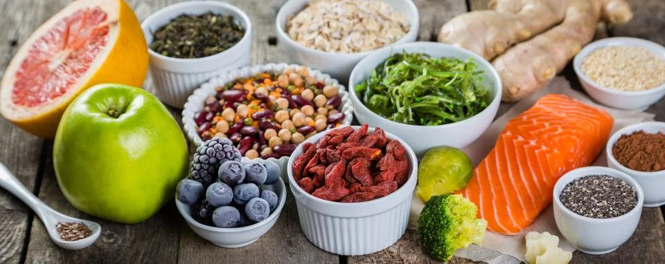Selection of superfoods on rustic background Stock Photos