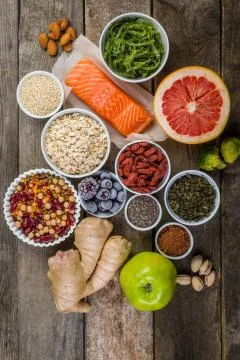 Selection of superfoods on rustic background Stock Photos