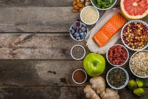 Selection of superfoods on rustic background Stock Photos
