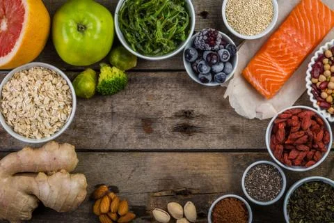 Selection of superfoods on rustic background Stock Photos