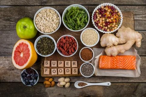 Selection of superfoods on rustic background Stock Photos