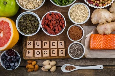 Selection of superfoods on rustic background Stock Photos