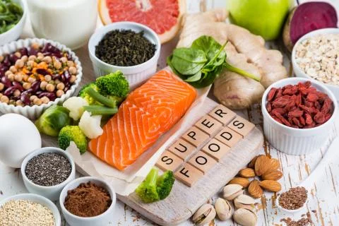 Selection of superfoods on rustic background Stock Photos