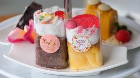 Selection of sweets, cakes, chocolate cake and chocolate brownie on white plate Видео 191483142