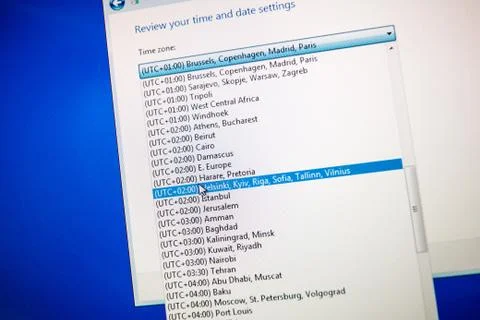 Selection of Time Zones on computer screen - global hour selection Stock Photos