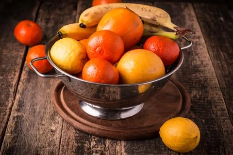 A selection of various fresh yellow raw organic produce fruits and vegetables Stock Photos