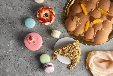 Selection of various pieces of cake - Choux pastries, macarons, chocolate vel Stock Photos