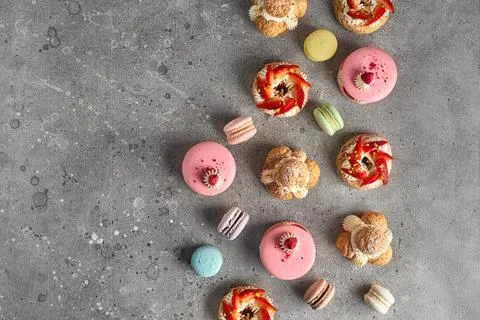 Selection of various pieces of cake - Choux pastries, macarons, chocolate vel Stock Photos