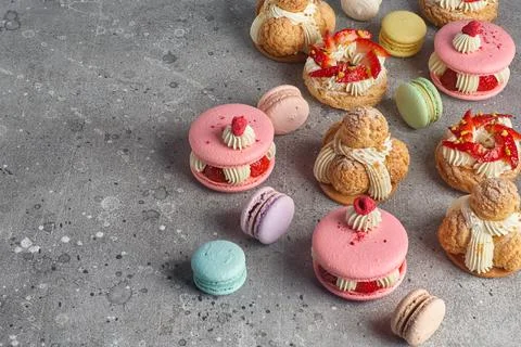 Selection of various pieces of cake - Choux pastries, macarons, chocolate vel Stock Photos