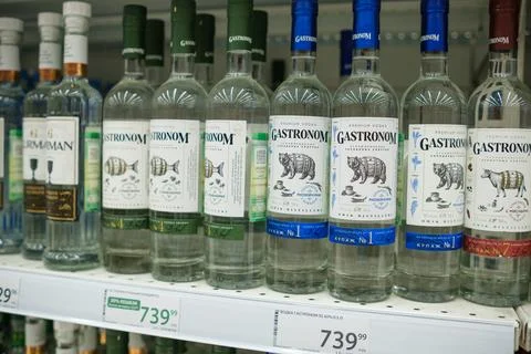 Selection of Vodka Bottles on a Store Shelf Highlighting Various Brands and Stock Photos