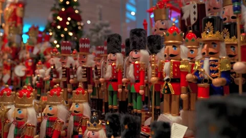 Selection of wooden nutcracker figurines displayed on shelves during christ.. Stock Footage 337447347