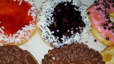 Selections of fresh delicious donuts at bakery shop Stock Footage 227875178