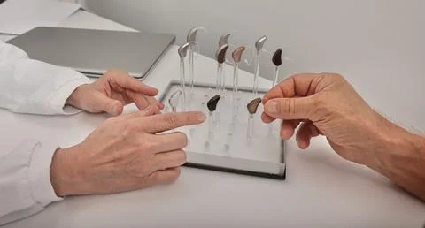 Selections of hearing aids. BTE hearing aids for mature man to treat hearin.. Foto stock