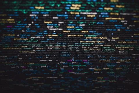 Selective closeup shot of data codes on a black computer monitor screen Foto stock