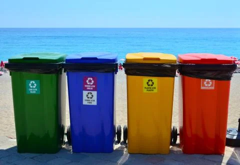 Selective collection of garbage colored containers. Colored recycle bins Stock Photos