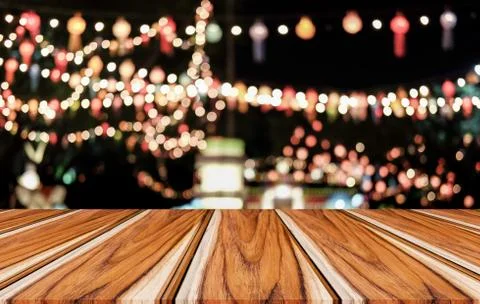 Selective Empty wooden table in front of abstract blurred festive light backg Stock Photos