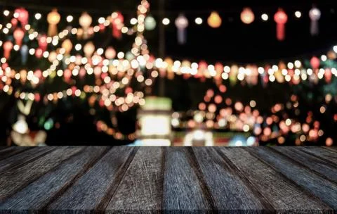 Selective Empty wooden table in front of abstract blurred festive light backg Stock Photos