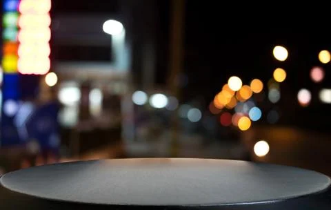 Selective Empty wooden table in front of abstract blurred festive light backg Stock Photos