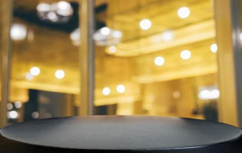 Selective Empty wooden table in front of abstract blurred festive light backg Stock Photos