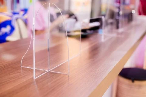 Selective focus to acrylic plastic installed in the office to prevent communi Stock Photos