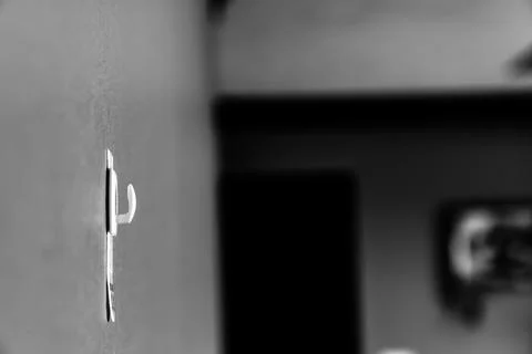 Selective focus on adhesive strip wall hanger that can be removed by pulling Stock Photos