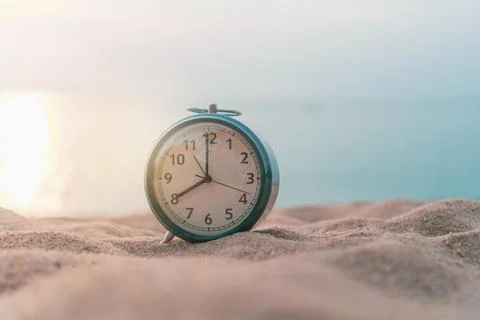 Selective focus of alarm clock with nature background. Stock Photos
