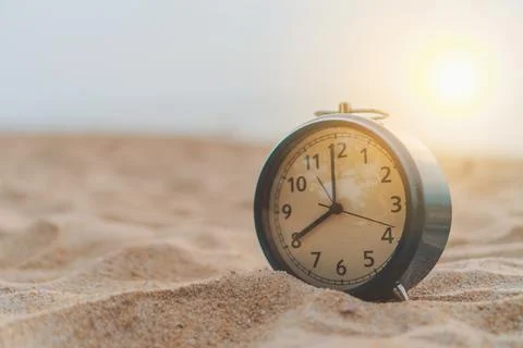 Selective focus of alarm clock with nature background. Stock Photos