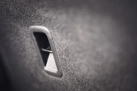 Selective focus on an anchor point for a forward-facing child car seat tether. Stock Photos