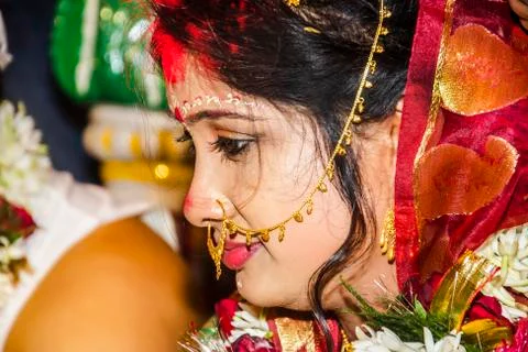 Selective focus and close up of a beautiful young Indian bride after vermilion. Stock Photos
