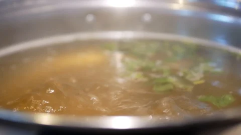 Selective focus and close up of boiling hot pot soup / broth (Shabu-shabu) Stock Footage 103493318