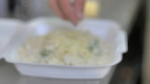 Selective focus and close up of street food, stir-fried morning glory being Stock Footage 127064412