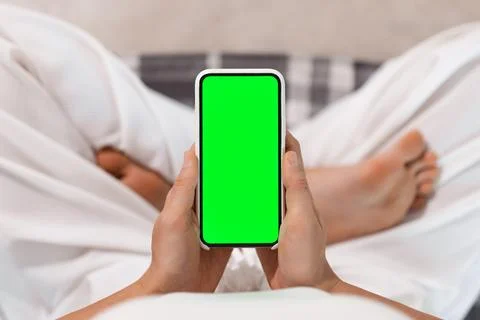 Selective Focus on App. High-Quality Ad Image of Woman Using Phone During Yoga Stock Photos